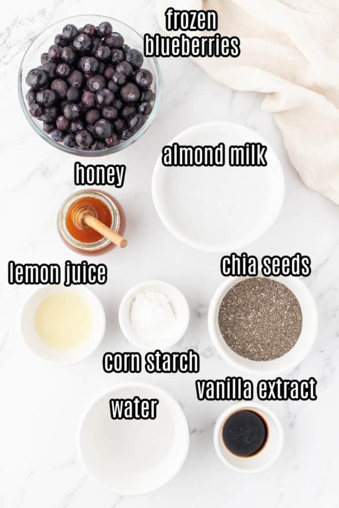 overnight blueberry chia seed pudding ingredients on a white background