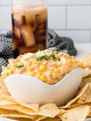 corn dip with cream cheese served with chips