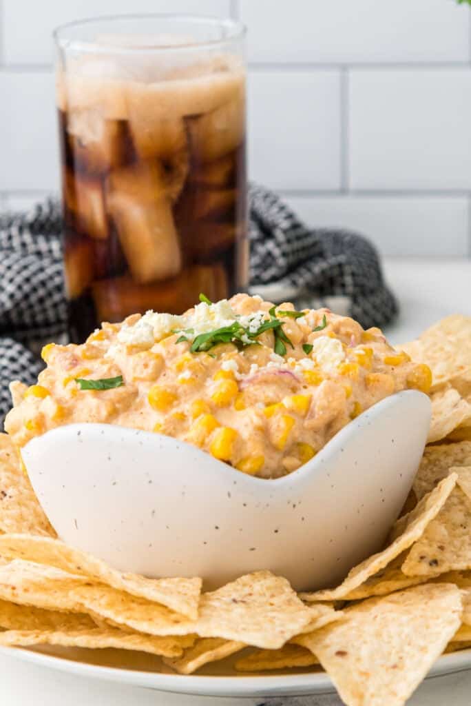 corn dip with cream cheese served with chips
