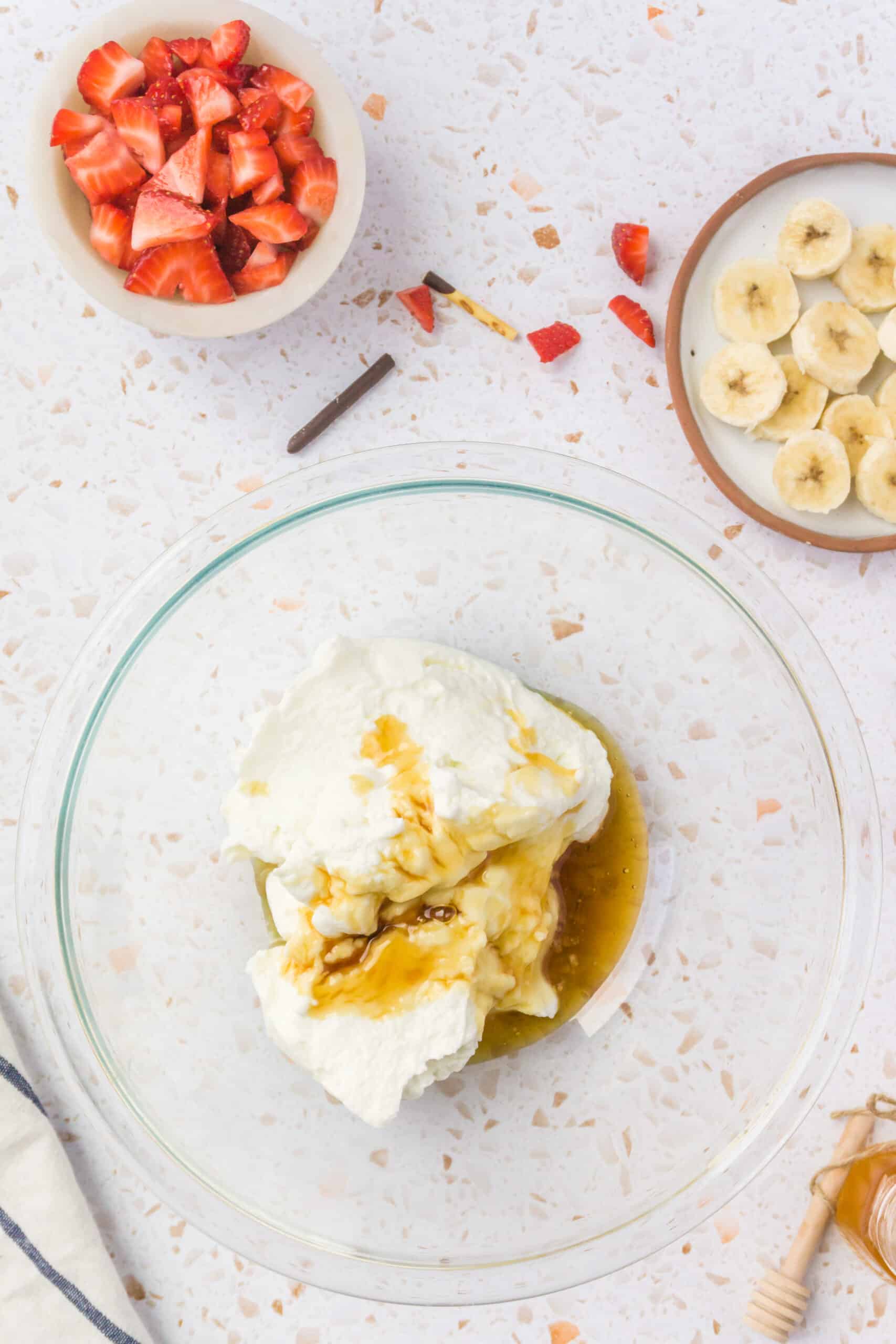 combining the greek yogurt with honey in a bowl