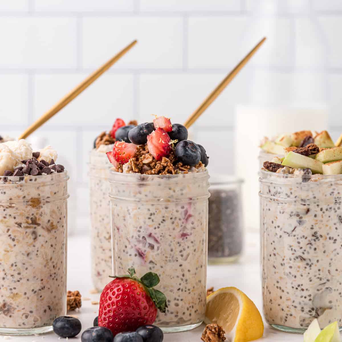 overnight oats three ways in mason jars with fruit toppings