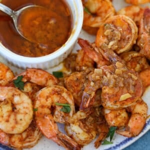 seafood boil sauce drizzled over shrimp