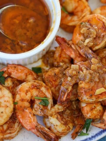 seafood boil sauce drizzled over shrimp