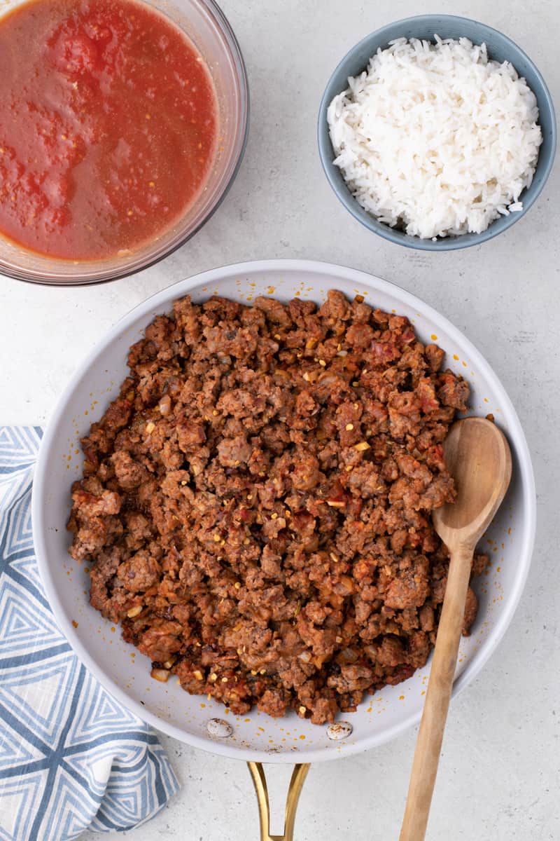 cook the ground beef and sweet Italian sausage for the stuffed bell peppers