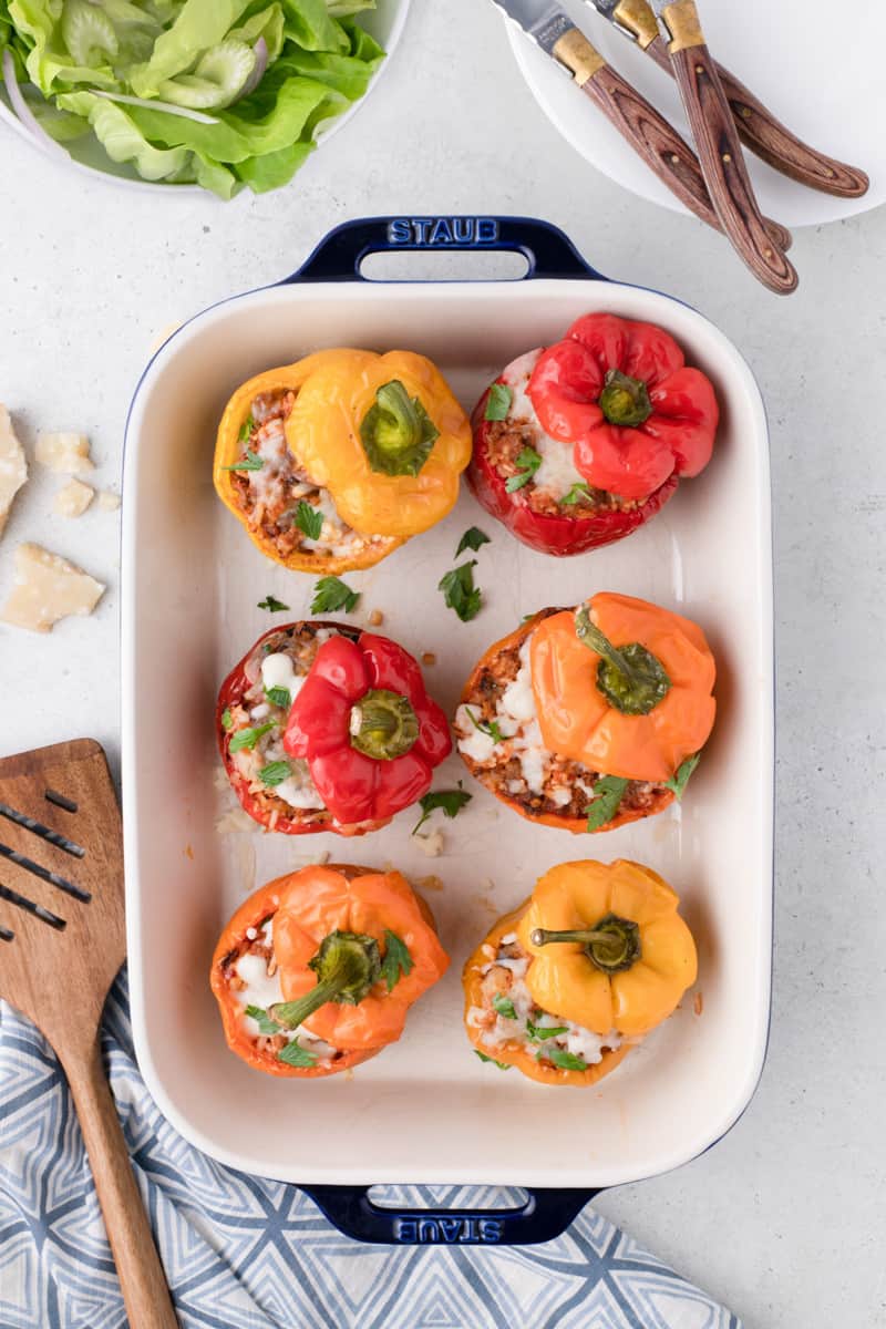 pulling the cooked peppers and out of the oven and letting them cool