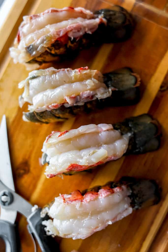 how to cut a lobster tail 5 on a cutting board
