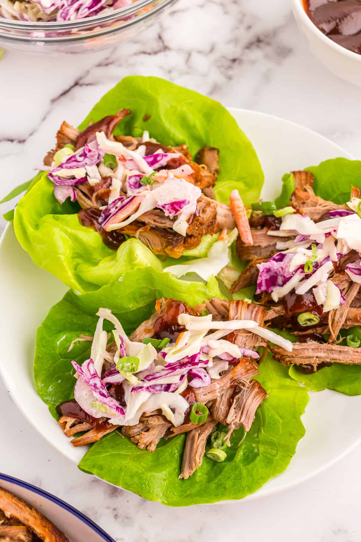 Prepped and served pulled pork lettuce wraps.