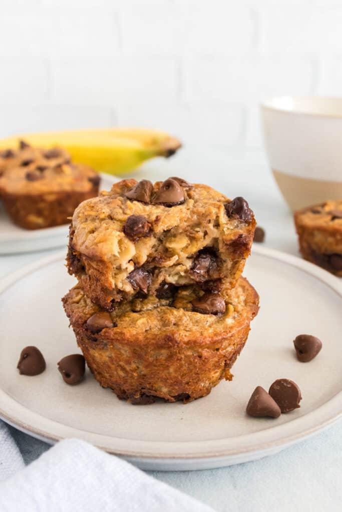 Baked oatmeal cups on a plate with a bite taken out of one.
