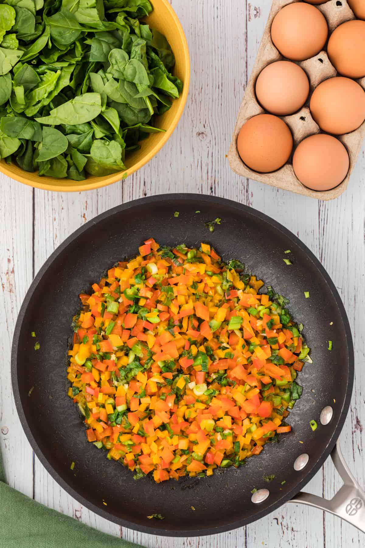 Diced peppers in a skillet.