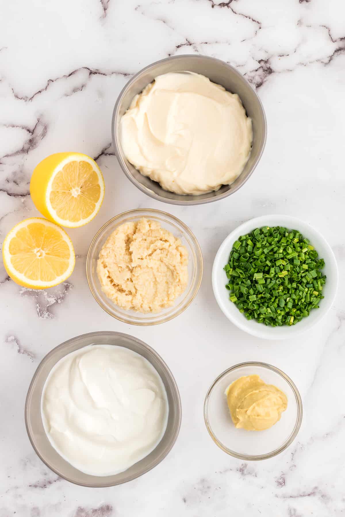 creamy horseradish sauce ingredients on a white marble counter