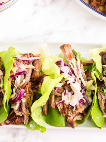Prepped and served pulled pork lettuce wraps.