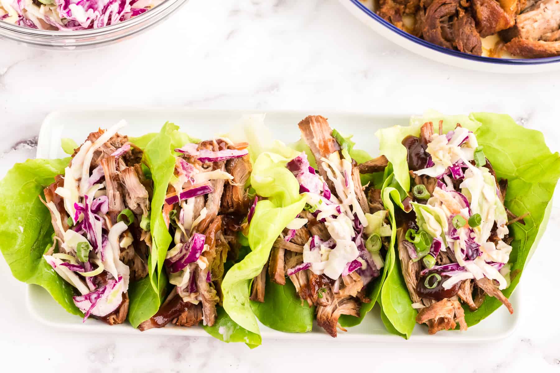 Prepped and served pulled pork lettuce wraps.