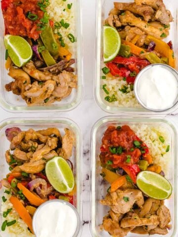 4 meal prep containers with chicken fajitas in them.