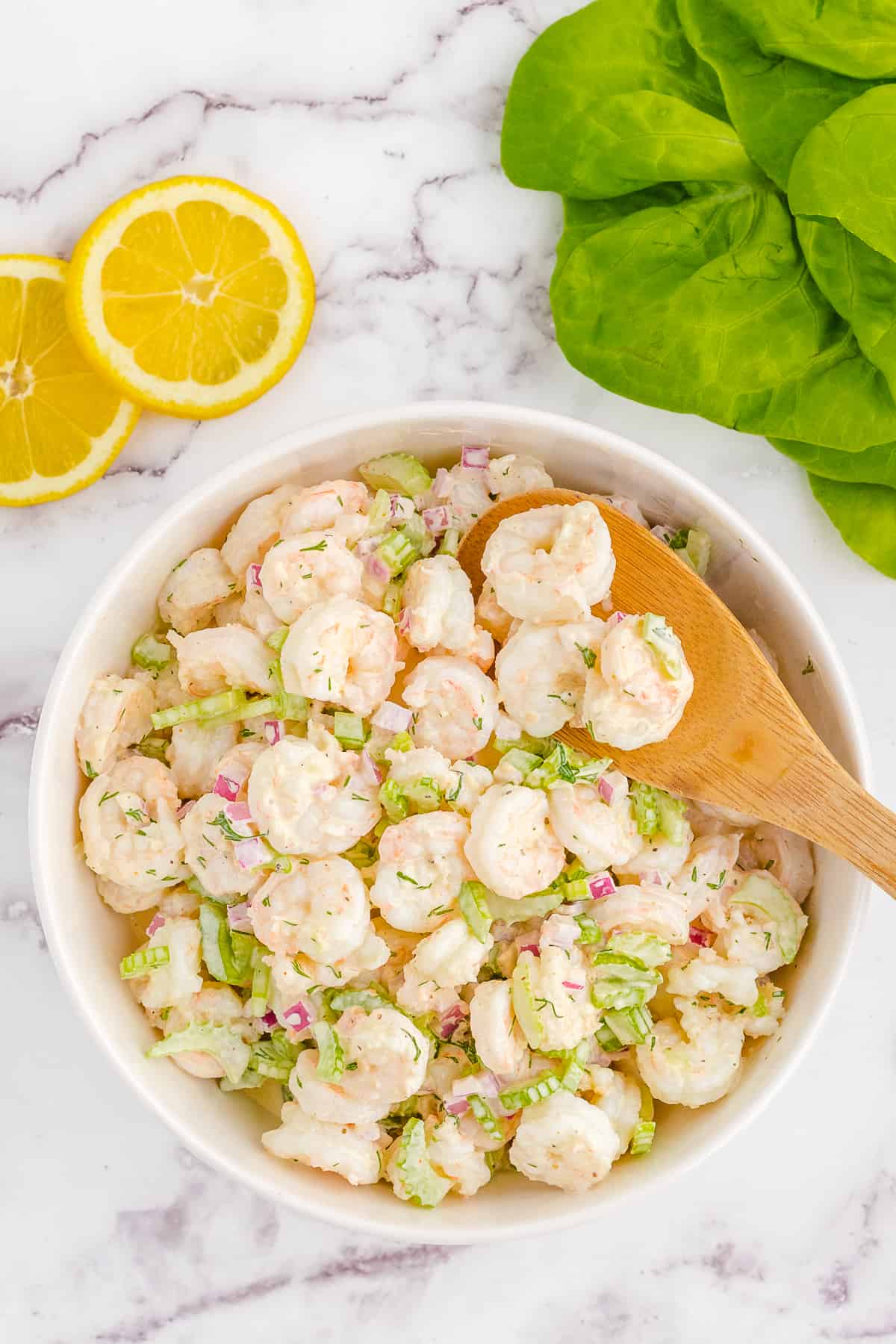 serving bowl with cold shrimp salad.