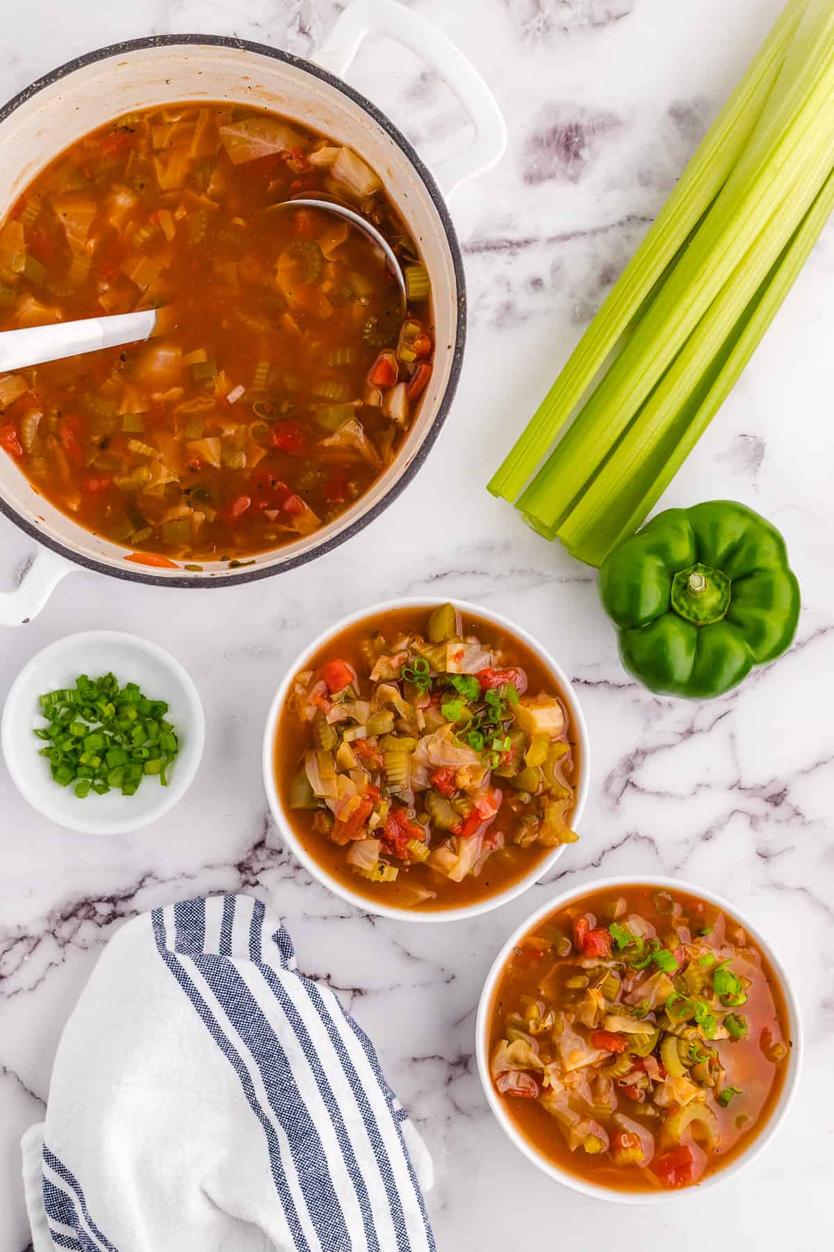 Two bowls full of detox cabbage soup.