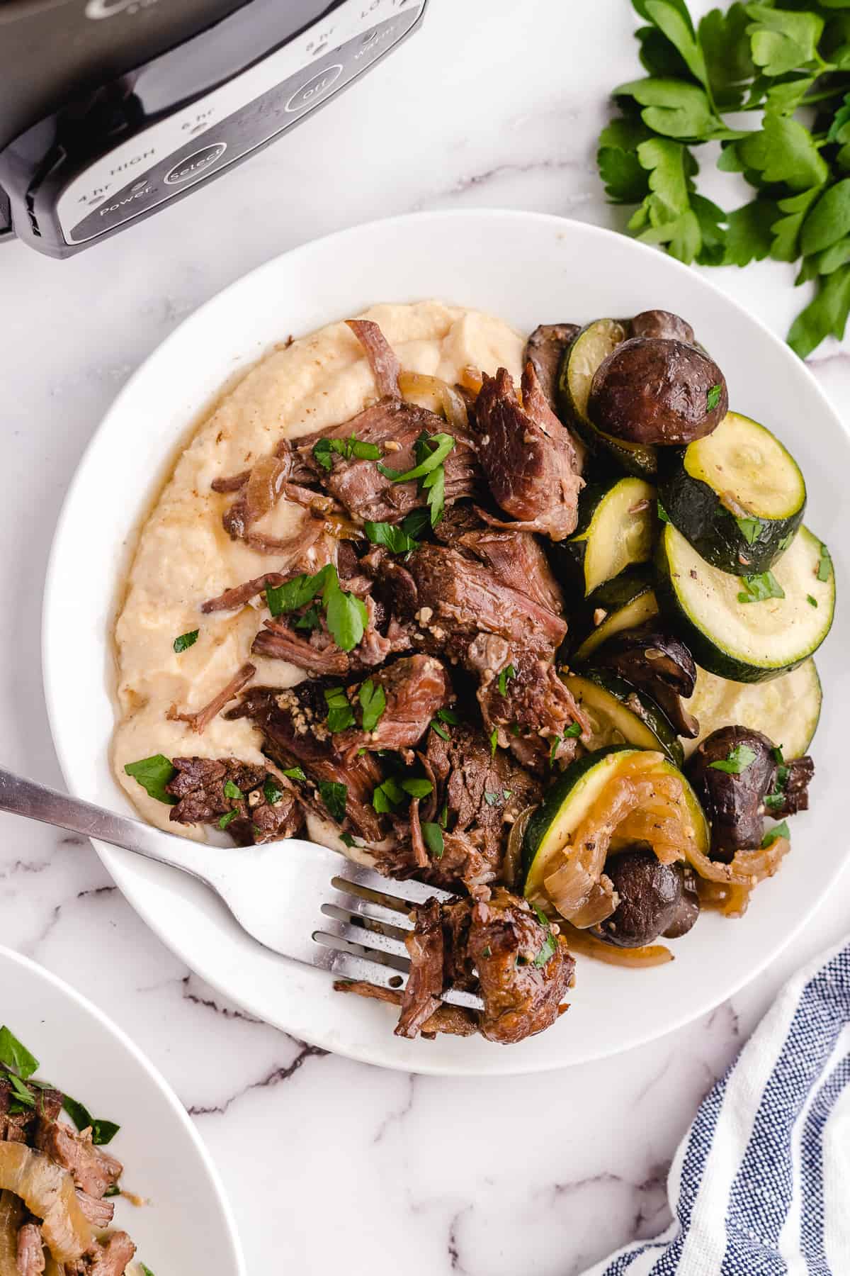 Keto pot roast served on a plate with a fork.
