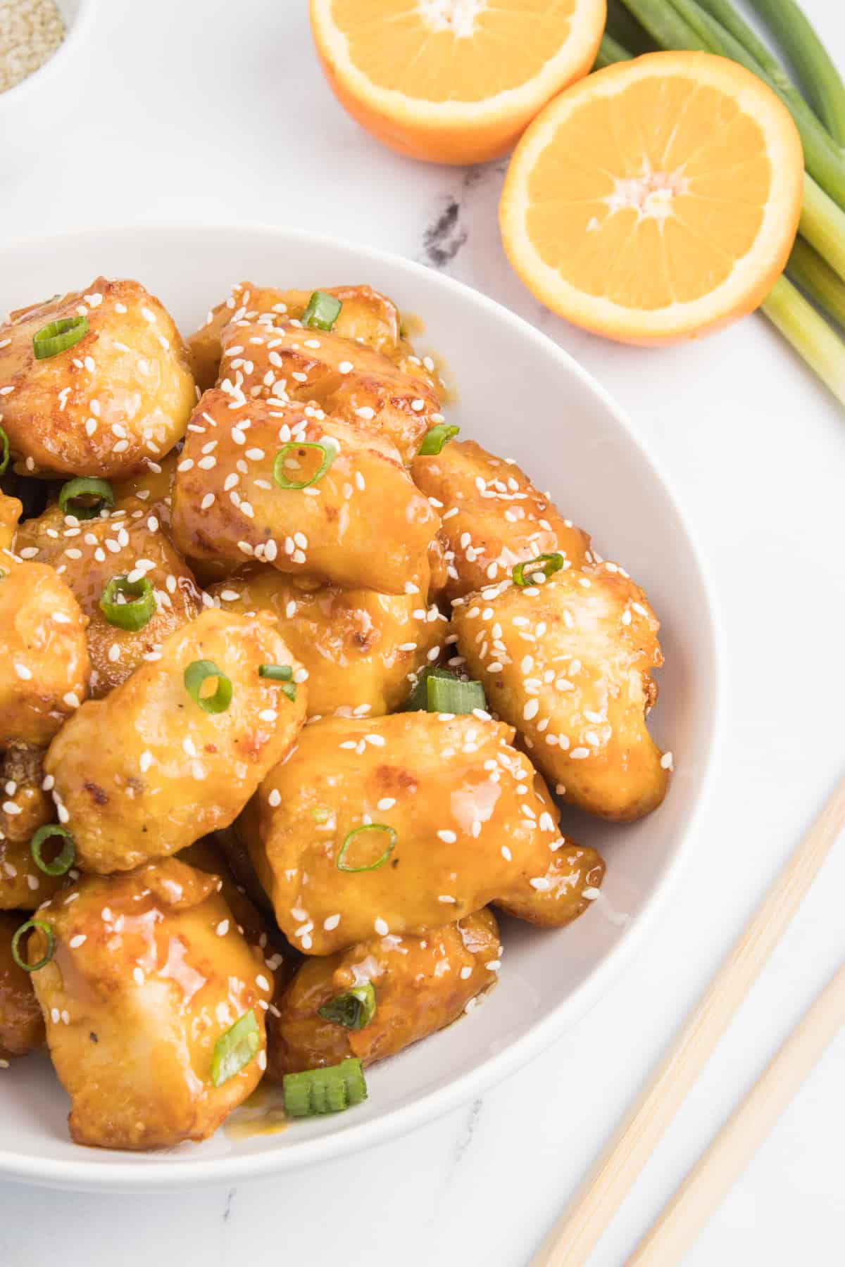 A bowl of fresh orange chicken.