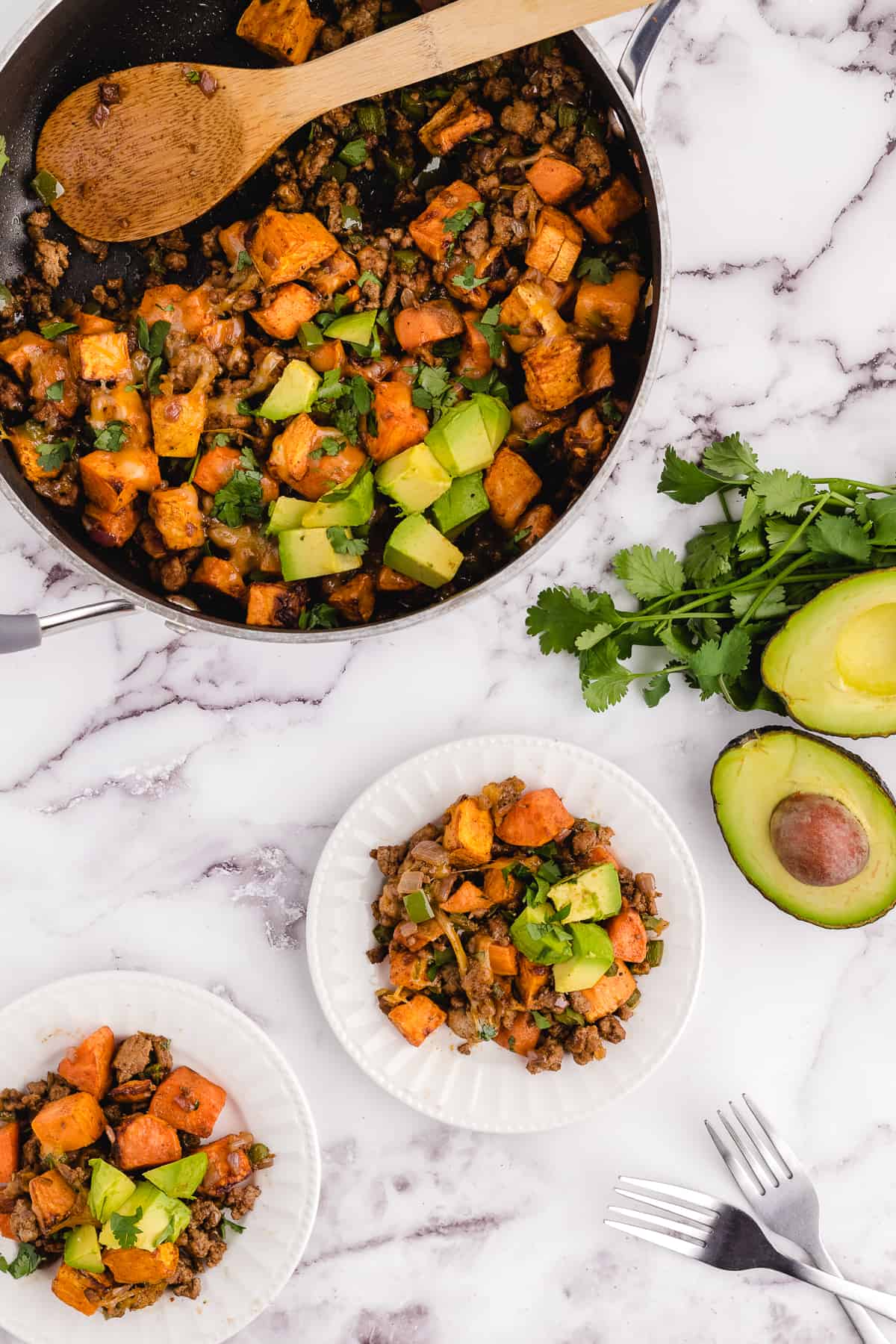 sweet potato turkey skillet being served on a plate.