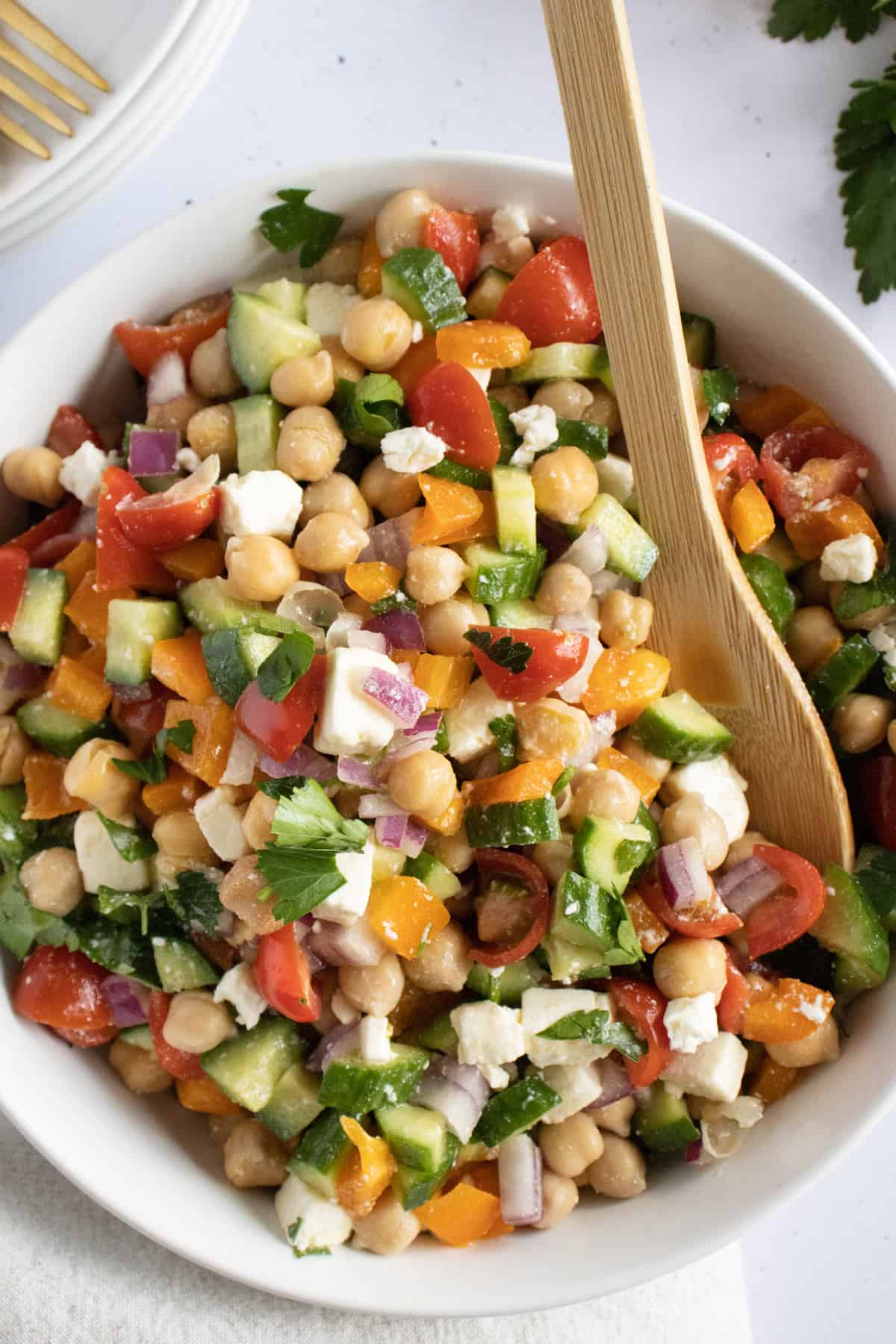chickpea salad mixed together in a bowl.