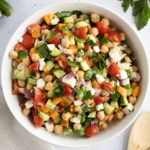 chickpea salad mixed together in a bowl.