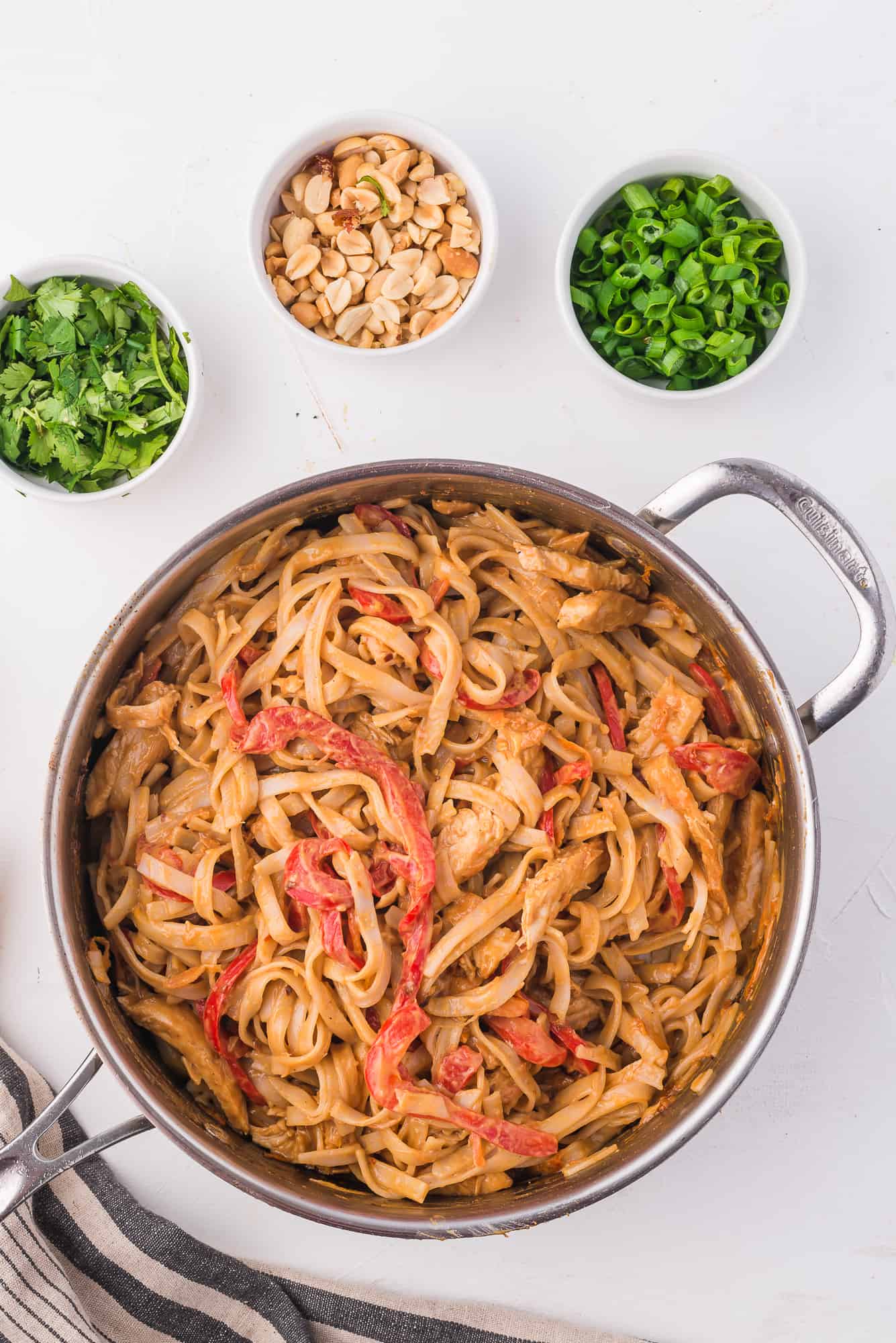 Thai peanut noodles in the pan before the garnish is put on.