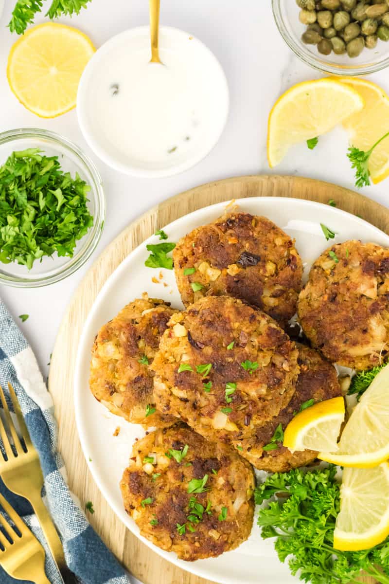 Fresh crab cakes being served on a plate.