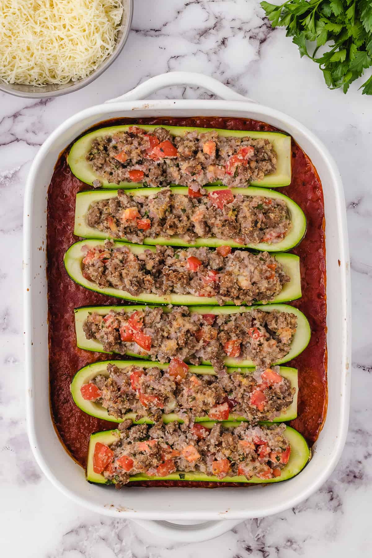 Italian Chicken Stuffed Zucchini 4 placed in a dish