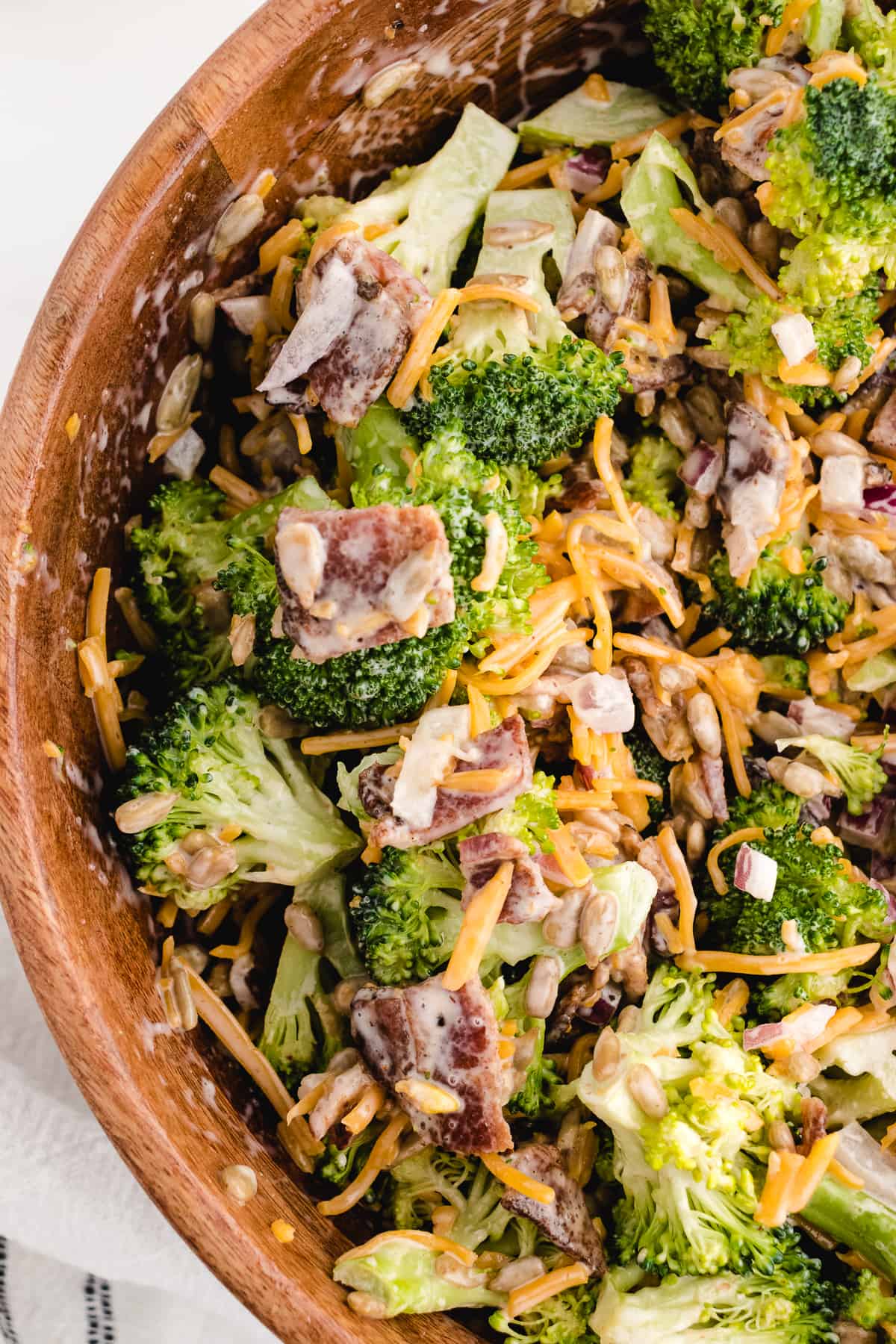 broccoli salad recipe with bacon in a wood bowl
