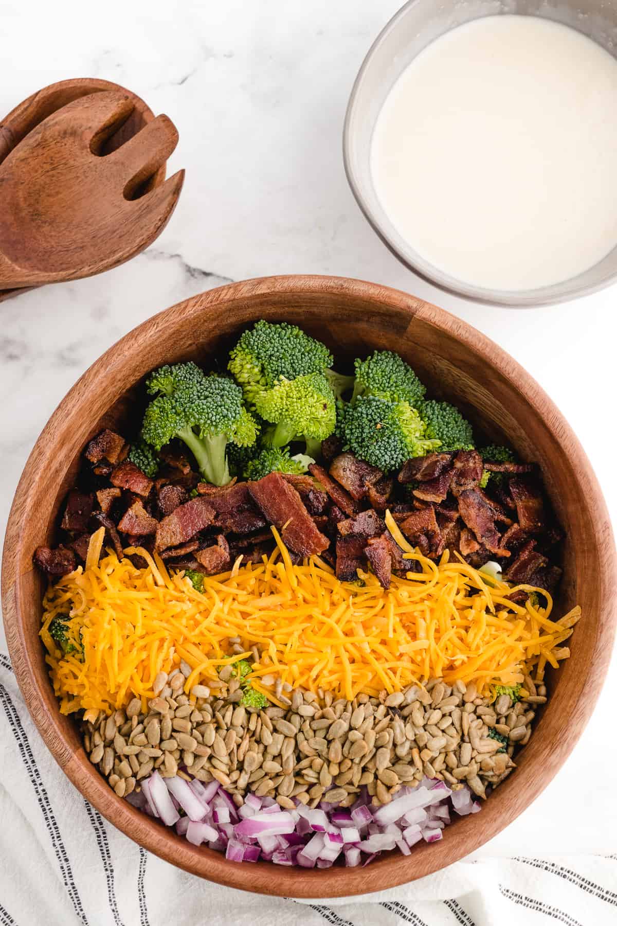 broccoli salad with bacon layered in a salad bowl