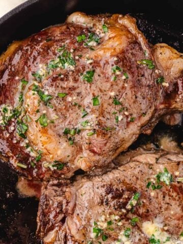 cast iron ribeye steak in the pan