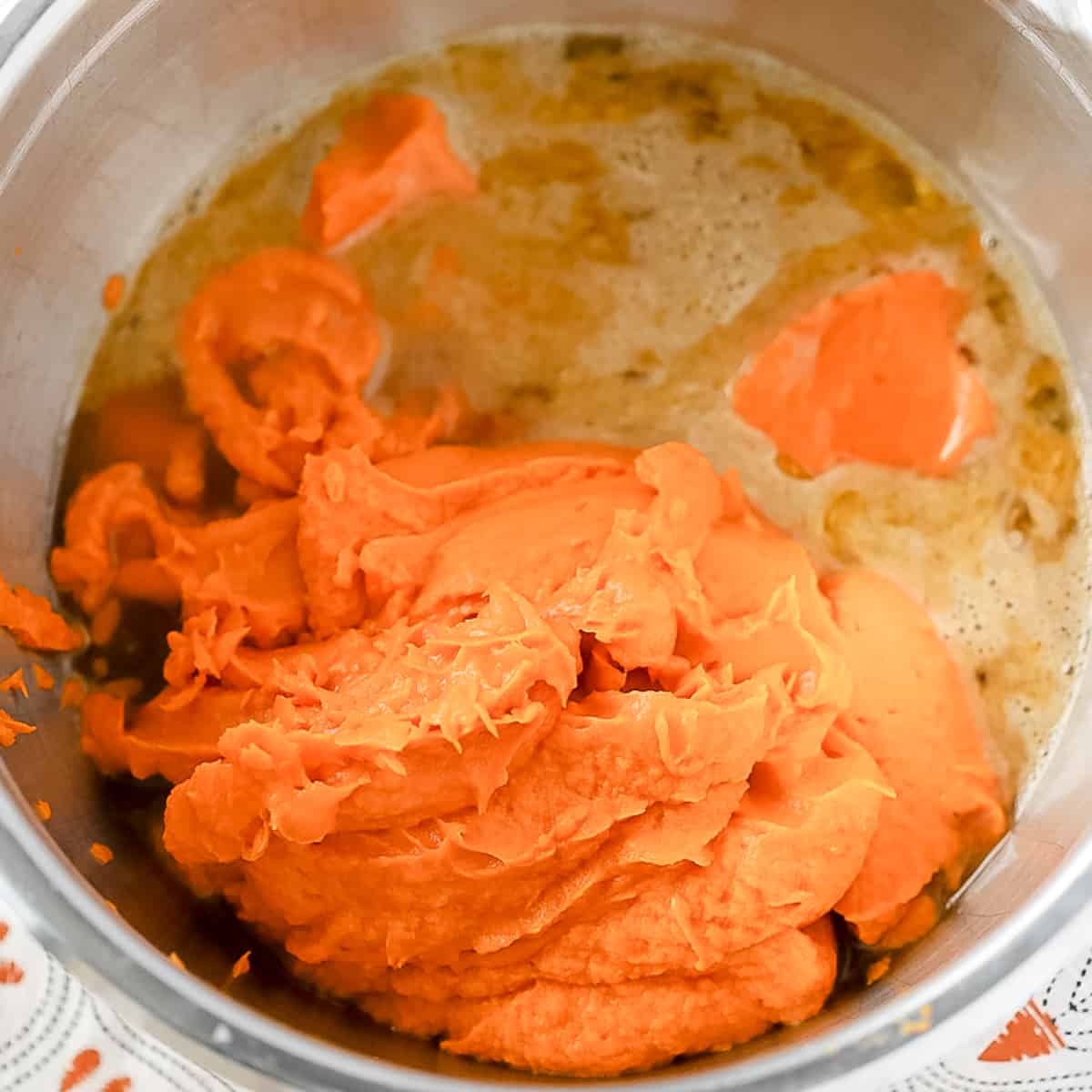 pureed sweet potatoes getting mixed with eggs 