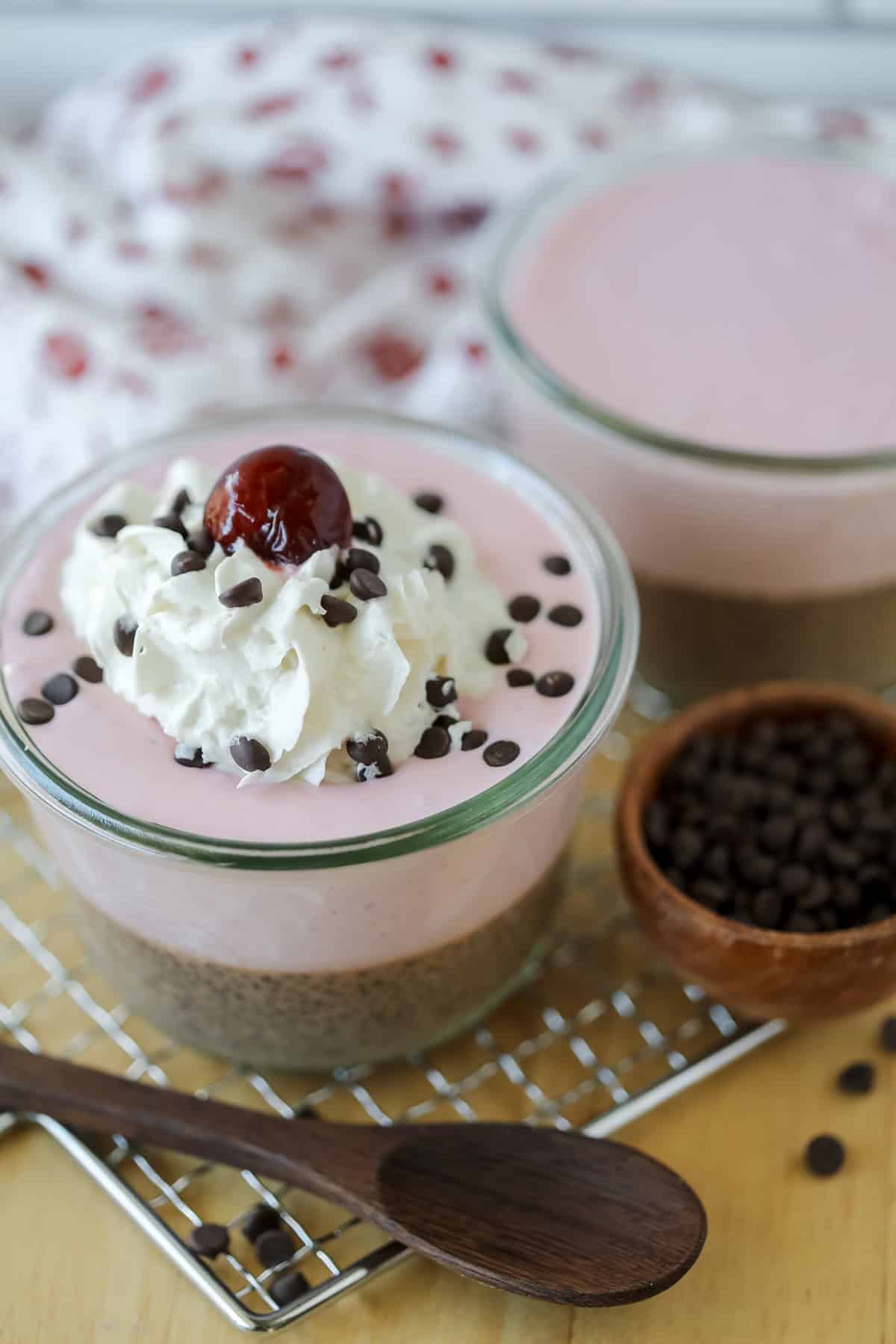 chocolate chia pudding on a cutting board with a Greek yogurt topping ready to eat