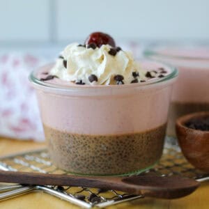 chocolate chia pudding with berries and greek yogurt close up image