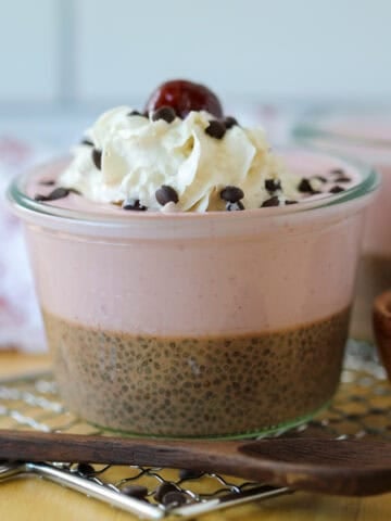 chocolate chia pudding with berries and greek yogurt close up image