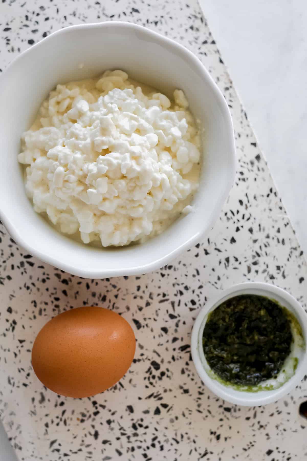 3 ingredient cottage cheese flatbread on a white cutting board