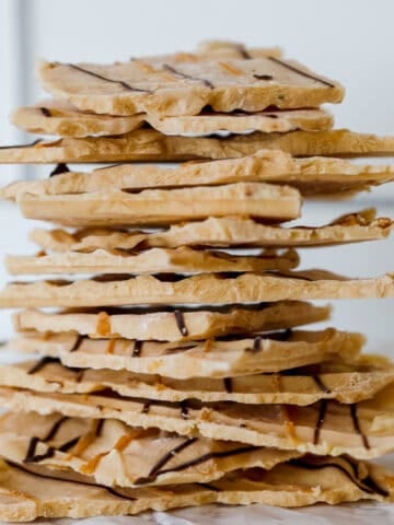 stacked up peanut butter yogurt bark drizzled with chocolate