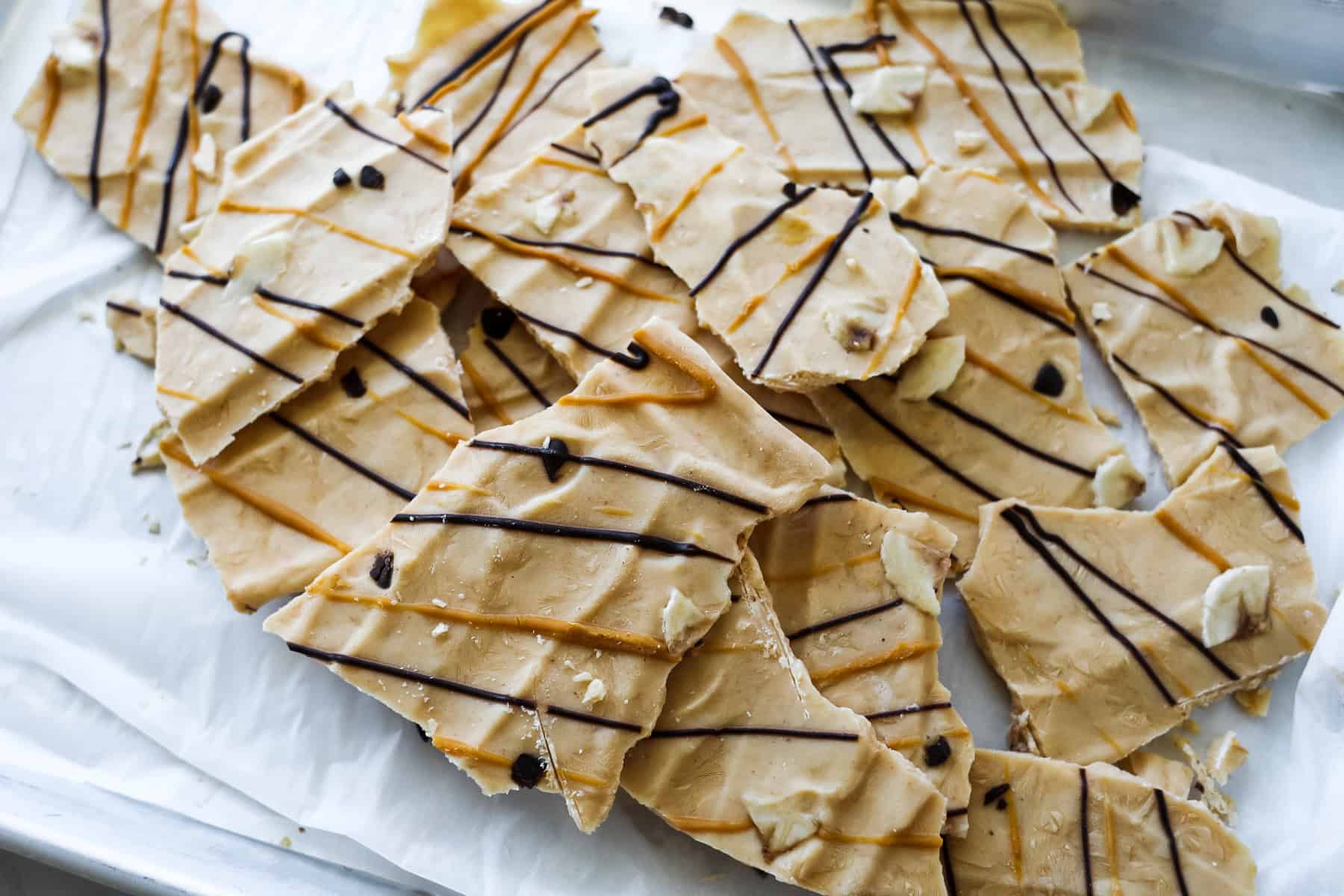 breaking peanut butter yogurt bark into pieces