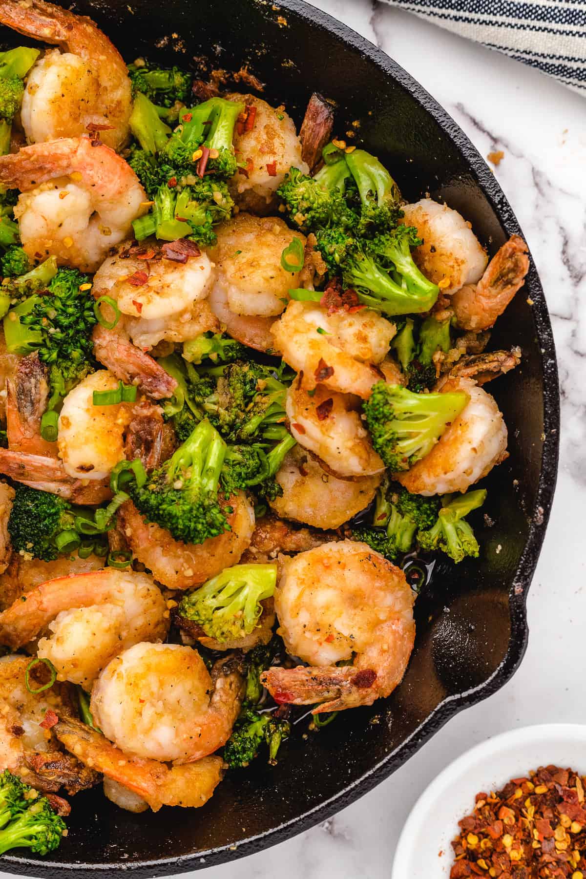 honey garlic shrimp in a cast iron skillet before serving