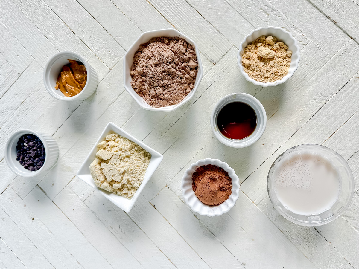 how to make high protein low carb protein balls with the ingredients sitting out on a white board