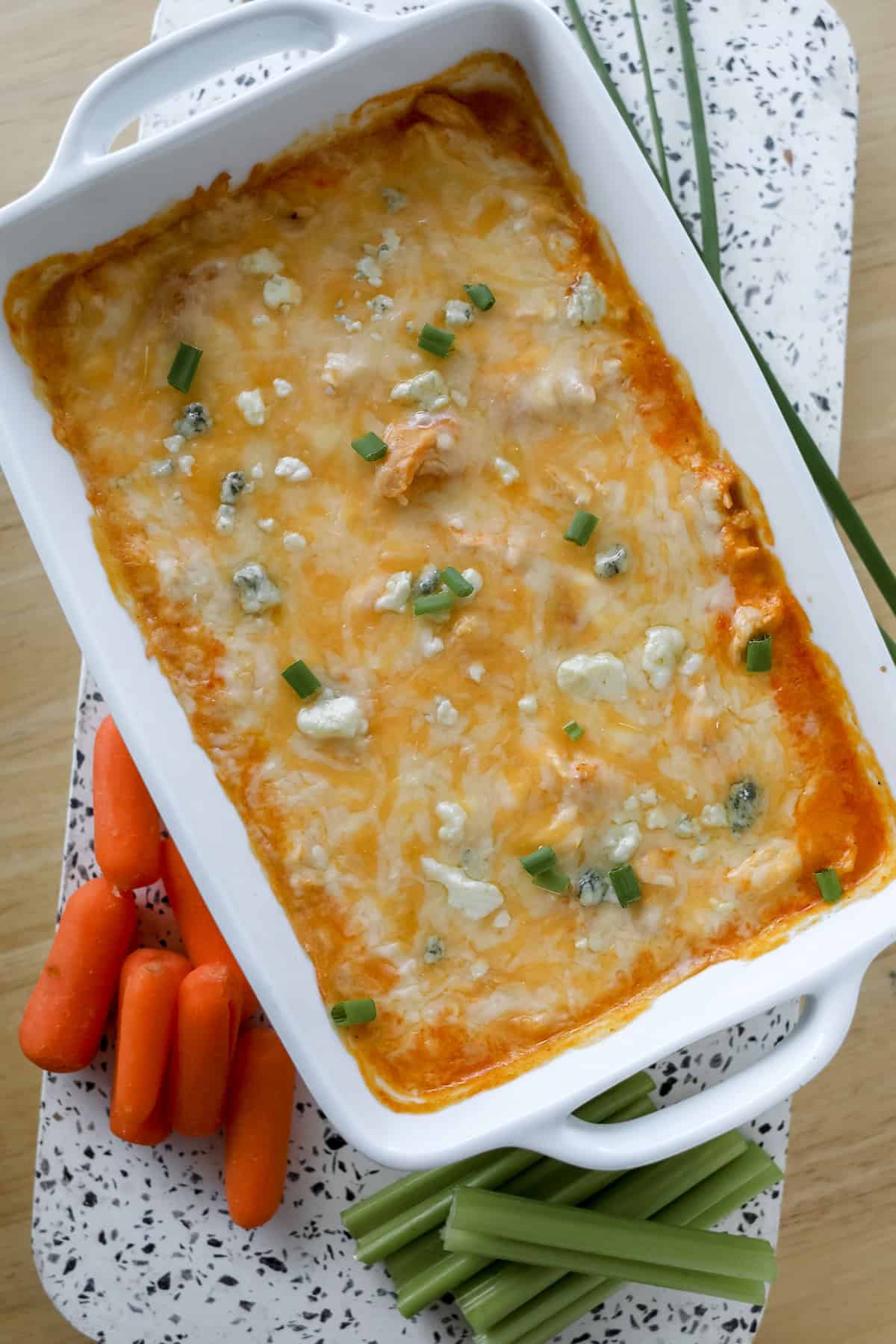buffalo chicken dip with cream cheese in a pan