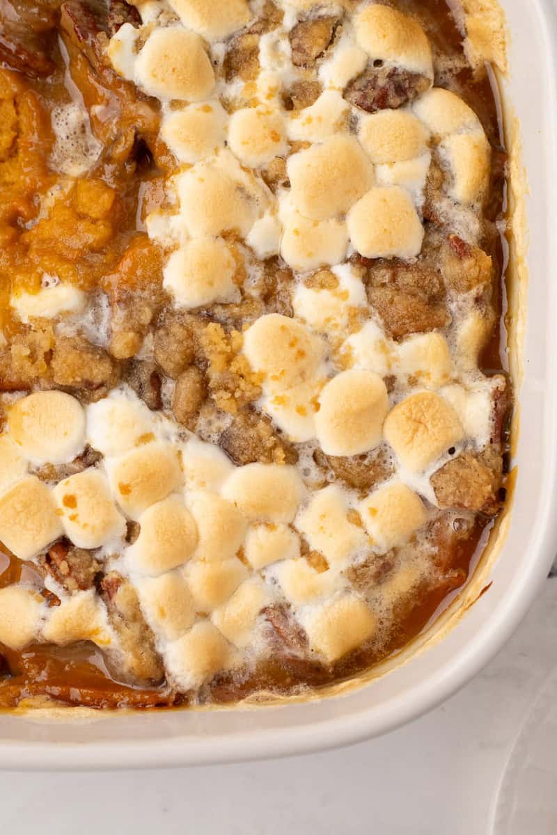 close up of a 9x13 pan of mashed sweet potato casserole