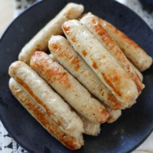 stacked air fryer breakast chicken sausage on a plate