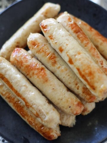 stacked air fryer breakast chicken sausage on a plate