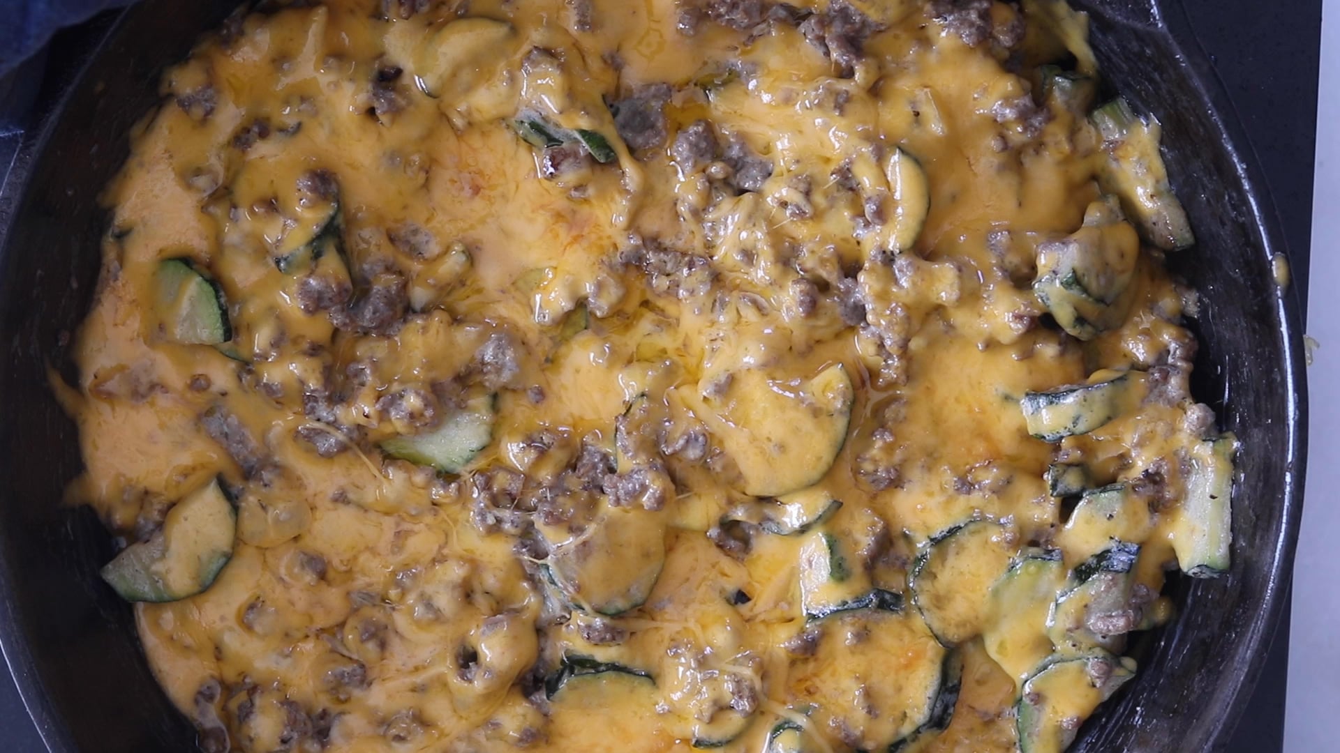adding cheese and broiling the top of the zuchini beef casserole
