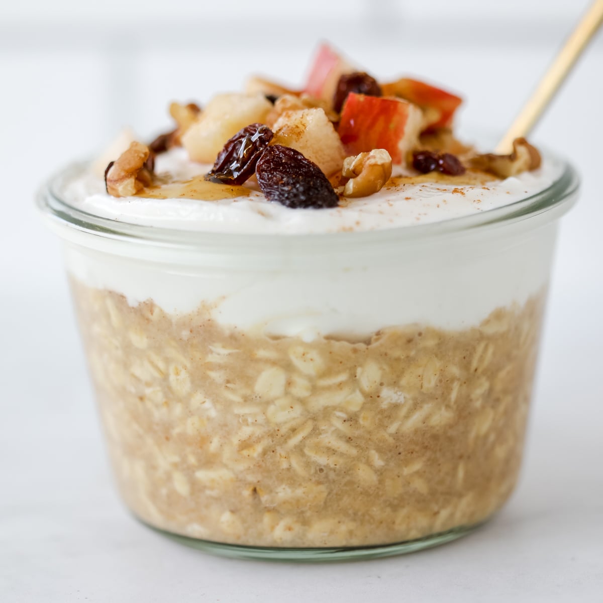 applesauce overnight oats with greek yogurt on top close up