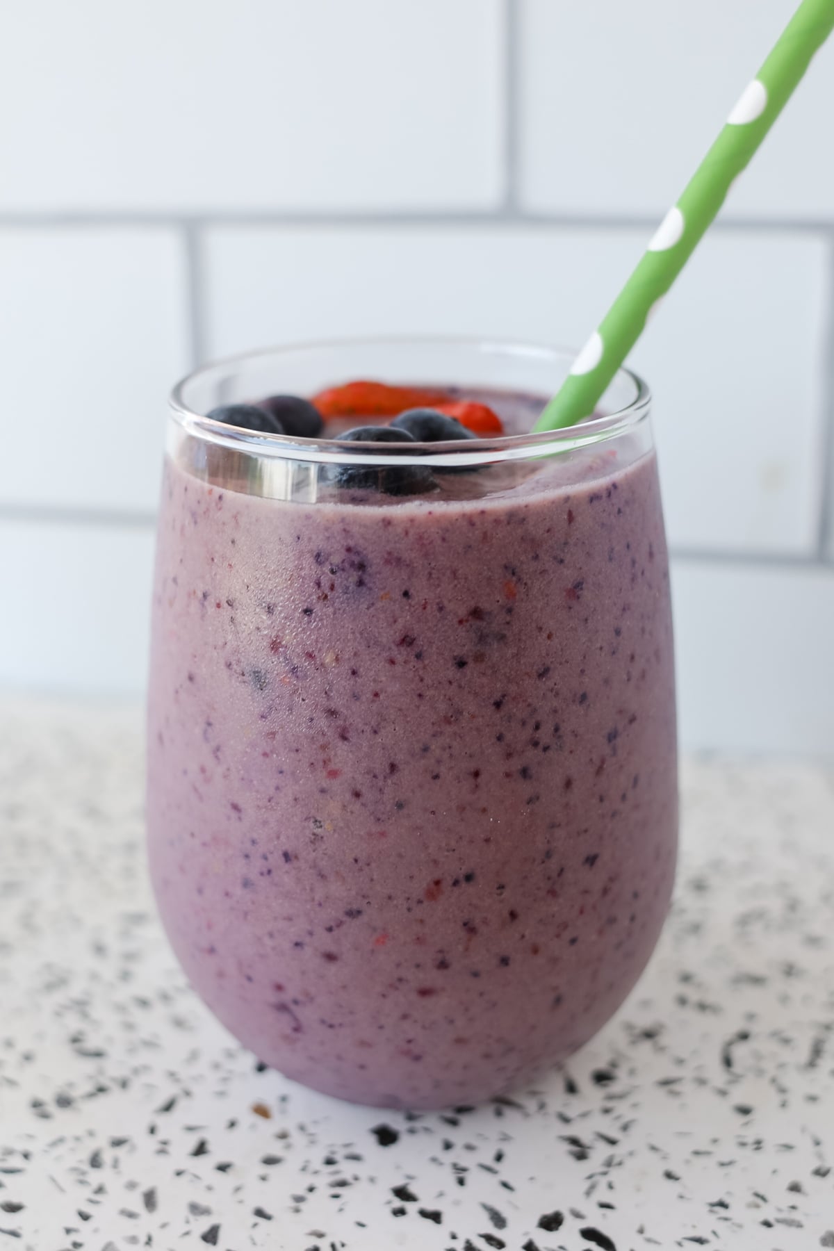 berry peanut butter smoothie on a white background