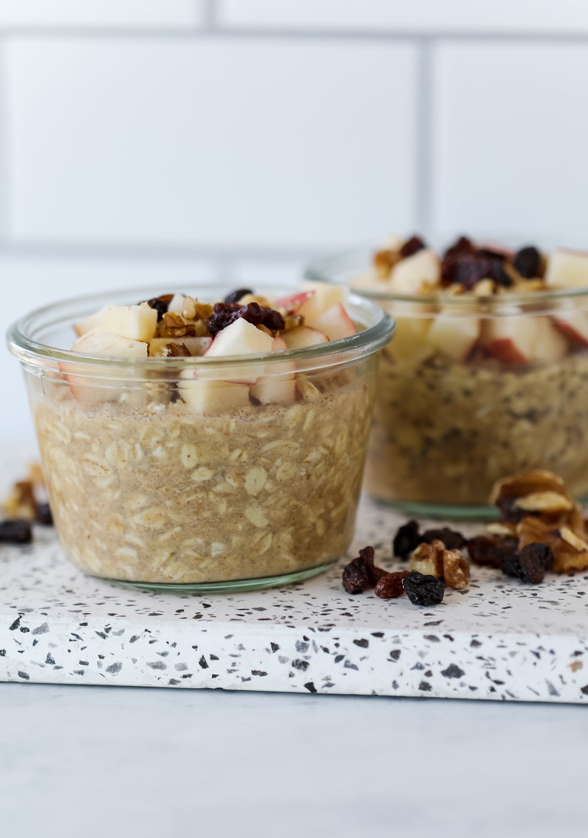 overnight oats with applesauce on a white cutting board