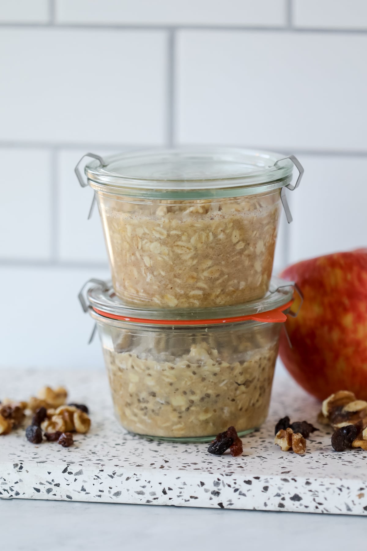 two jars of apple cinnamon overnight oats stacked on top of each other