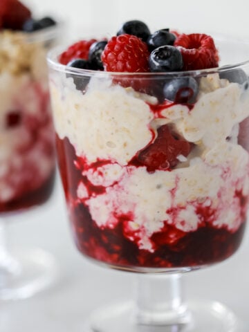 overnight oats with cottage cheese and frozen fruit close up in a dessert dish