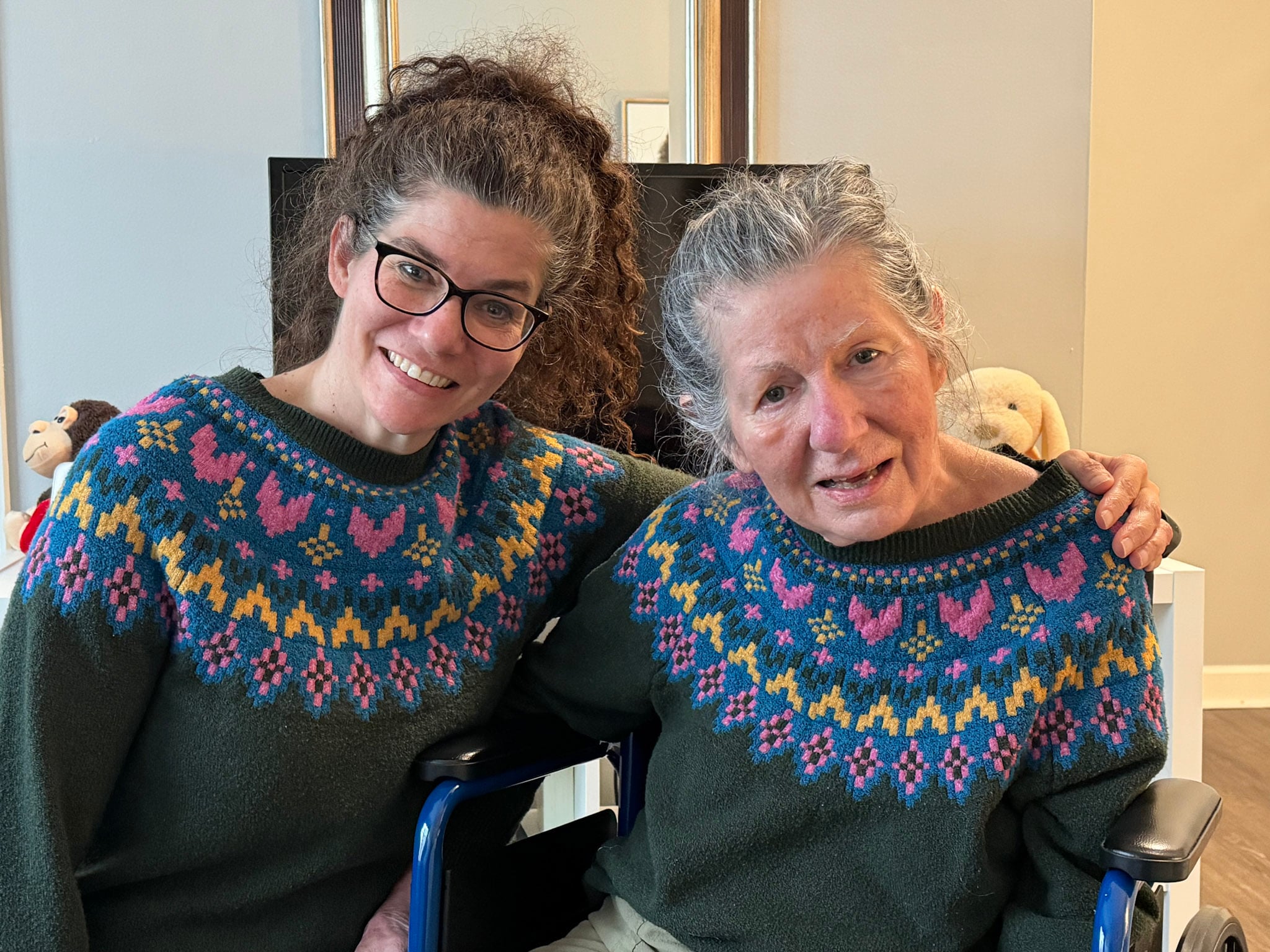 jenni cole with mom in memory care facility matching heart sweaters